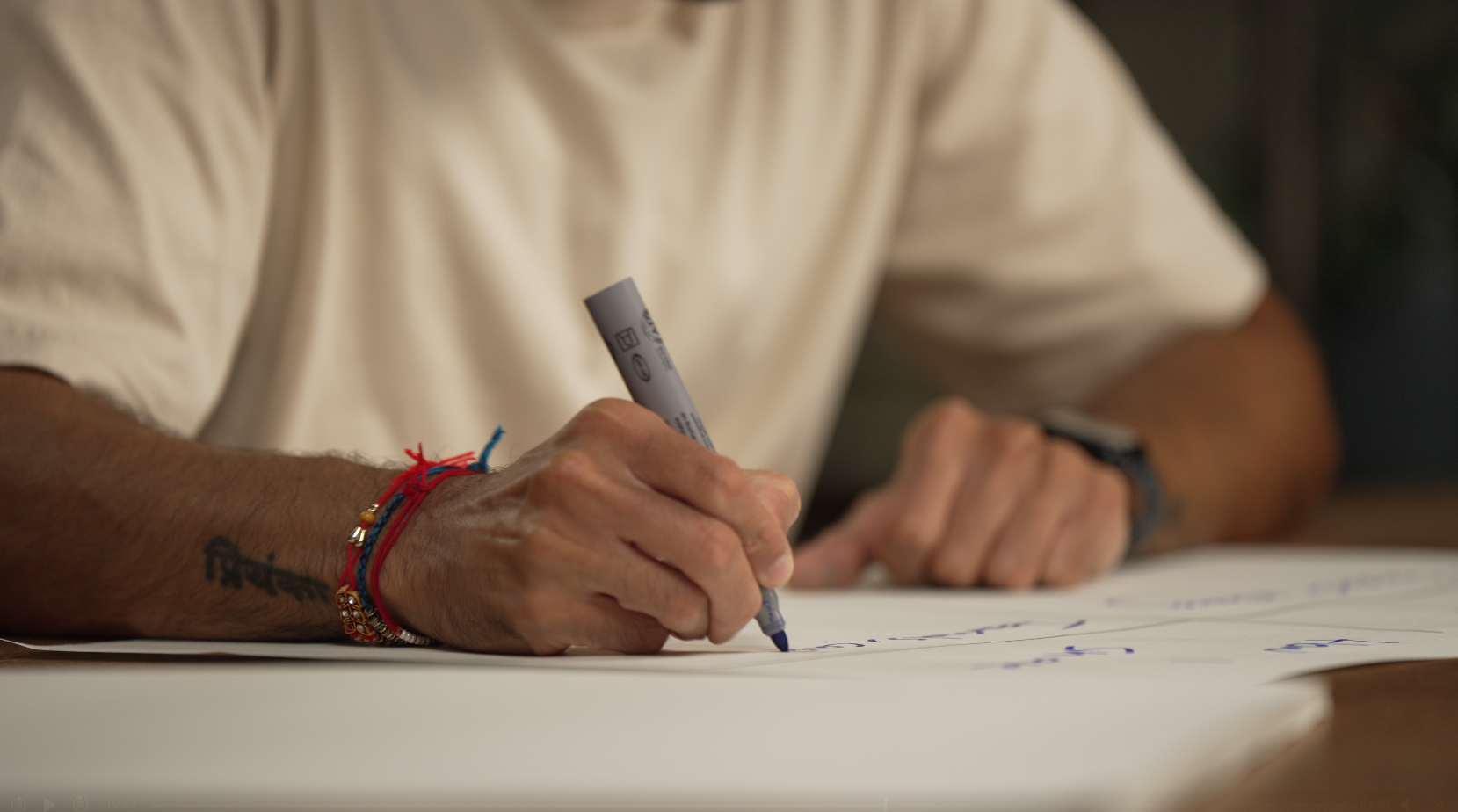 Karan Kashyap writing notes during a workshop